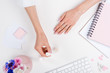 © LIGHTFIELD STUDIOS - cropped shot of young woman doing french manicure at workplace
