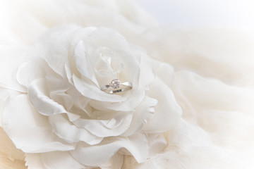 wedding ring on white rose for valentine's day