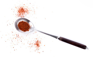 Wall Mural - Pile of red paprika powder on spoon wooden