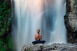 © Alexander Grabchilev/Stocksy - young man praying outdoors