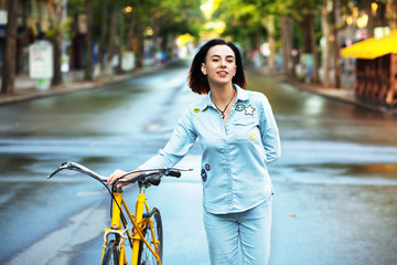 Wall Mural - Lovely woman woman with a bicycle