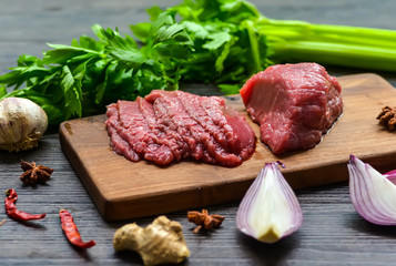 Wall Mural - Raw beef meat on a cutting board