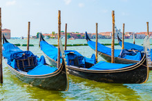 Blue Gondolas Moored In Venice, Italy