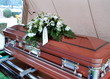 Casket at a funeral service outdoors.