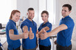 © Andrey Popov - Happy Janitors Showing Thumb Up Sign