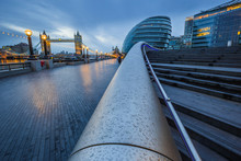 London, England - Tower Bridge And Office Buildings On A Rainy Day At Blue Hour