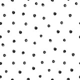 Vector illustration of hand drawn seamless pattern. Black dots isolated on white background.