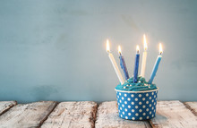 Birthday Concept With Cupcake And Candles On Wooden Table.