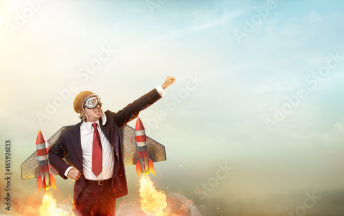 Cuadros en Lienzo Aviator Businessman With Jetpack On His Back - Startup Concept