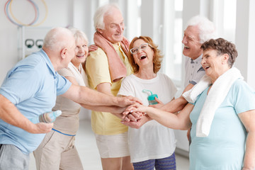 Canvas Print - Elders laughing before yoga classes