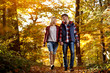 © luckybusiness - smiling couple enjoying walking in the park.
