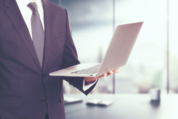 Poster - Man holding laptop