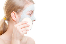 Woman Having Mud Green Mask On Her Face