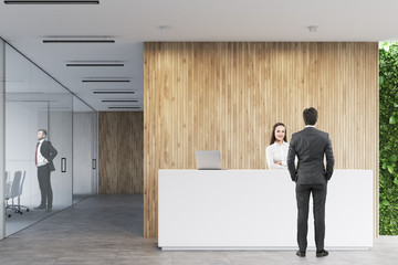 Wall Mural - Business people near a reception in office