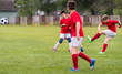 © Dusan Kostic - Kids soccer football - children players match on soccer field