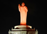 Fototapeta  - Buddha statue at night in Hussain Sagar in Hyderabad, India.