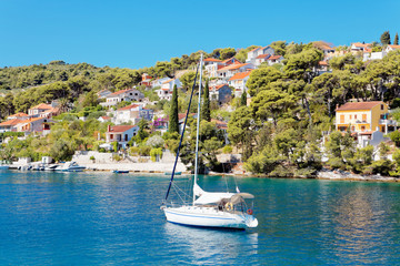 Wall Mural - Yatch in the harbor of a small town Splitska - Croatia, island Brac