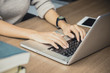 © Bavorndej - Woman hand using laptop for work. people working concept.