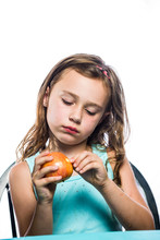 Pretty Snaggle Toothed Girl Eating An Apple On A White Background