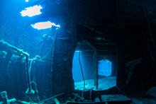 The Wreck Of The Doc Poulson In Grand Cayman Is An Artificial Reef And Is Now Home To Much Coral And Fish Life. The Little Sunken Vessel Is A Popular Attraction For Adventurous Scuba Divers