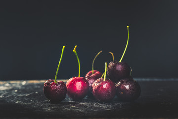 cherries berries in black bowl , vintage style