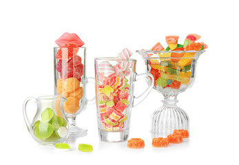 Sticker - Colorful candies in glassware on white background