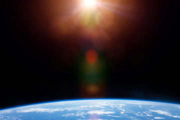 Wall Mural - planet Earth lit by the intense Sun