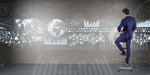 Poster - Businessman using graph screens interface on a wall 3D rendering