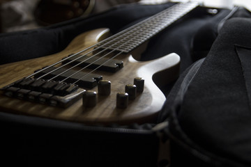 Bass guitar in the case, close up