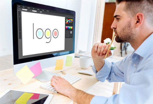 Young graphic designer working in the office