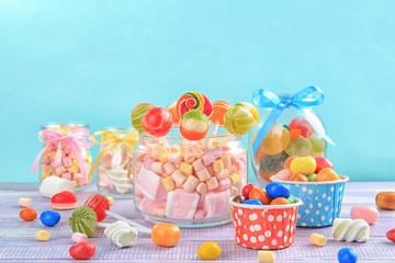 Canvas Print - Composition with tasty candies on table