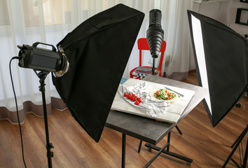 Wall Mural - Photo studio with professional lighting equipment during shooting food