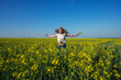 © sanechka - Happy young woman, with flying hair and open arms jumping