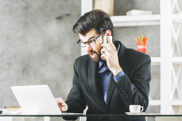 Wall Mural - Angry man at workplace