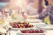 © Kalim - Friends having barbecue party in backyard