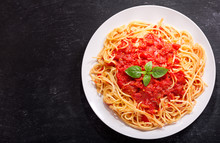 Plate Of Pasta With Tomato Sauce And Green Basil