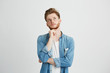 © Cookie Studio - Portrait of dreamy young handsome guy thinking dreaming with hand on chin over white background.