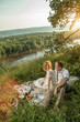 © diter - Attractive Couple Enjoying Romantic Sunset Picnic in the Countryside
