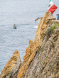 Cliff diver, diving 115 feet into the Pacific Ocean in Acapulco, a major seaport and tourist resort in the state of Guerrero on west coast of Mexico, 