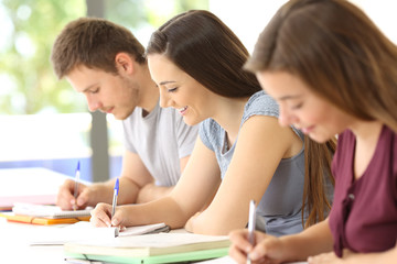 Sticker - Students studying taking notes in a classroom