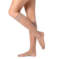 Sticker - Legs of beautiful young woman in knee socks on white background