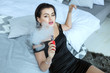 © Petro - Young and beautiful woman with smoke from an electronic cigarette.
