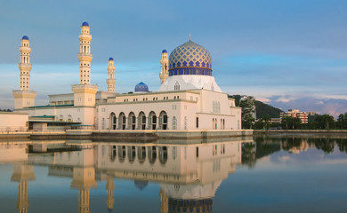 Colorful sunset at Kota Kinabalu floating mosque. Famous landmark in Kota Kinabalu on beautiful tropical sunet, Sabah Borneo, Malaysia.