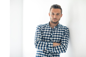 Confident handsome man with arms crossed