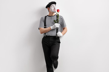 Poster - Mime artist smelling a flower