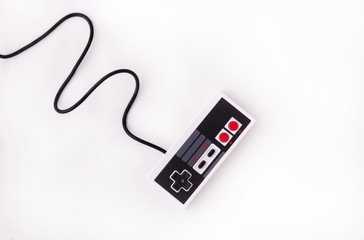 Old joystick on a white background. Video game console GamePad on a white background. Top view