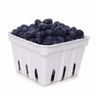 Fresh blueberries in a white paper carton isolated on a white background