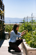© seanlockephotography - Workspace: Businesswoman Takes A Break To Work In Rooftop Garden