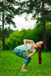 © Natalia Chircova - Young woman doing yoga outdoor