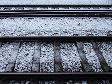 Snow And Frost On Railway Tracks In Winter Running In Parallel Lines